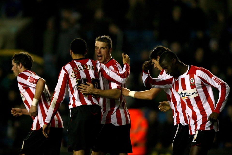 LONDON, ENGLAND - JANUARY 16: Richard Lambert (C) of Southampton is congratulated by team mates after he scores his freekick during the Coca-Cola League One match between Millwall and Southampton at The New Den on January 16, 2010 in London, England. (Photo by Dean Mouhtaropoulos/Getty Images)