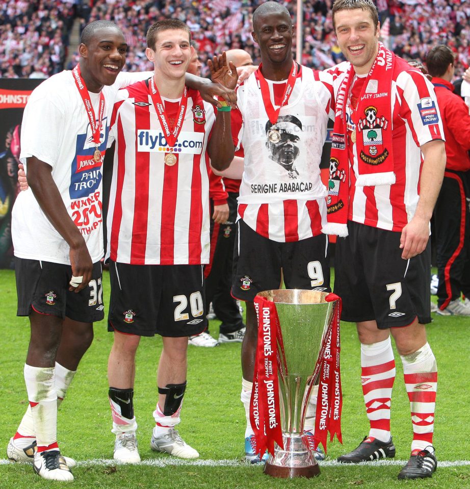 Football - Carlisle United v Southampton Johnstone's Paint Trophy Final - Wembley Stadium - 28/3/10 (L-R) Southampton's four goalscorers Michail Antonio, Adam Lallana, Papa Waigo N'Diaye and Richie Lambert celebrate with the trophy Mandatory Credit: Action Images / Paul Childs Livepic