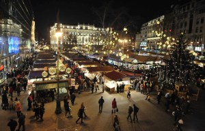 a crowd of people are gathered at a christmas market