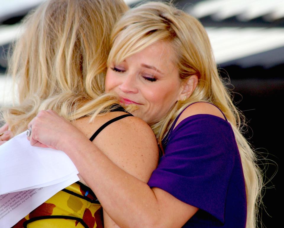 Reese gives Goldie a big hug after her speech 