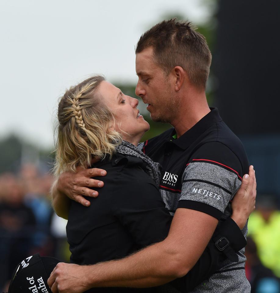Henrik Stenson and Emma Lofgren kiss after he wins The Open at Royal Troon