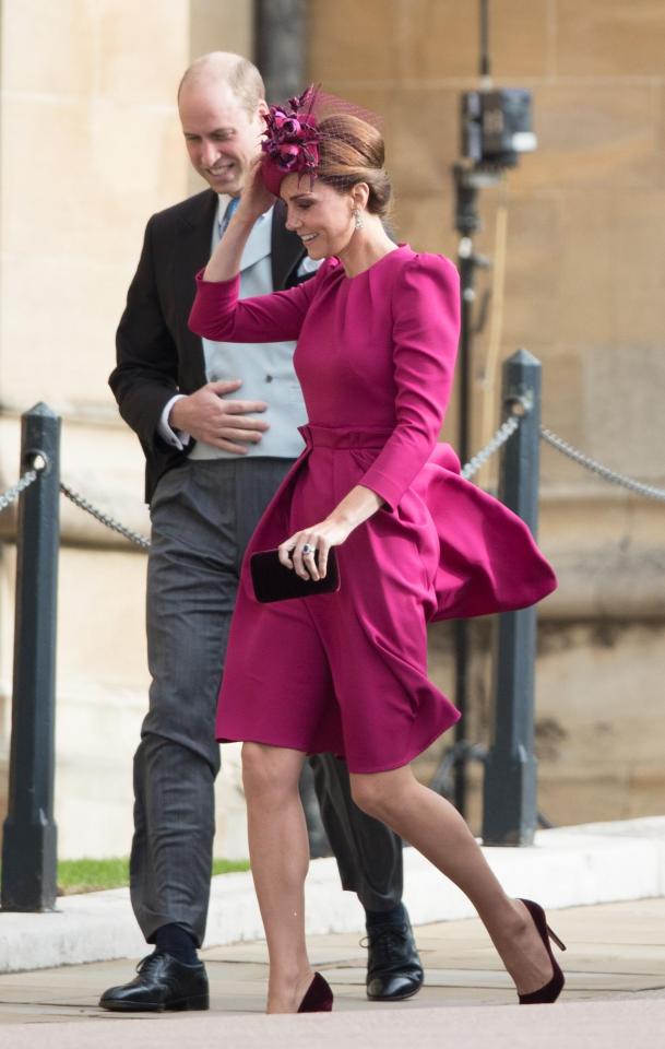  Kate Middleton, pictured with Prince William, handles the strong winds at Princess Eugenie's wedding like a pro