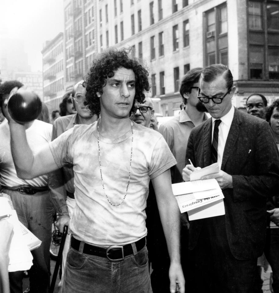 Abbie Hoffman holds a toy bomb in New York City on Sept. 16, 1969