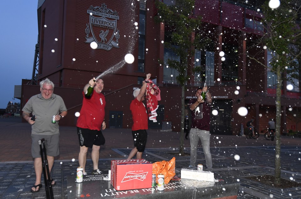  Ecstatic Liverpool fans swarmed into the streets to party after City's defeat