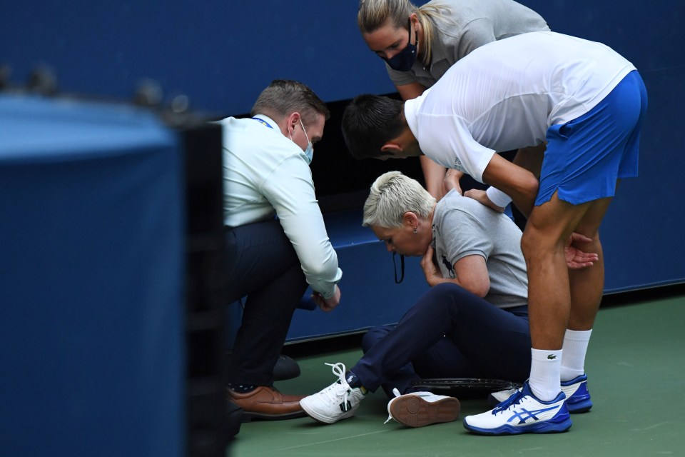 The line judge fell to the ground after being hit