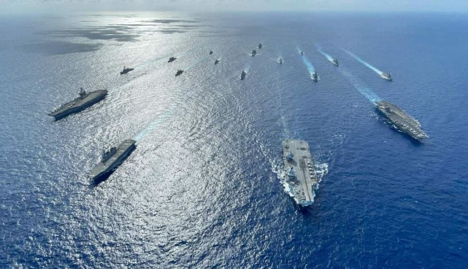 Britain's HMS Queen Elizabeth warship (second right at the head of the armada) took part in joint training with warships from six different countries over the weekend in the Philippine Sea