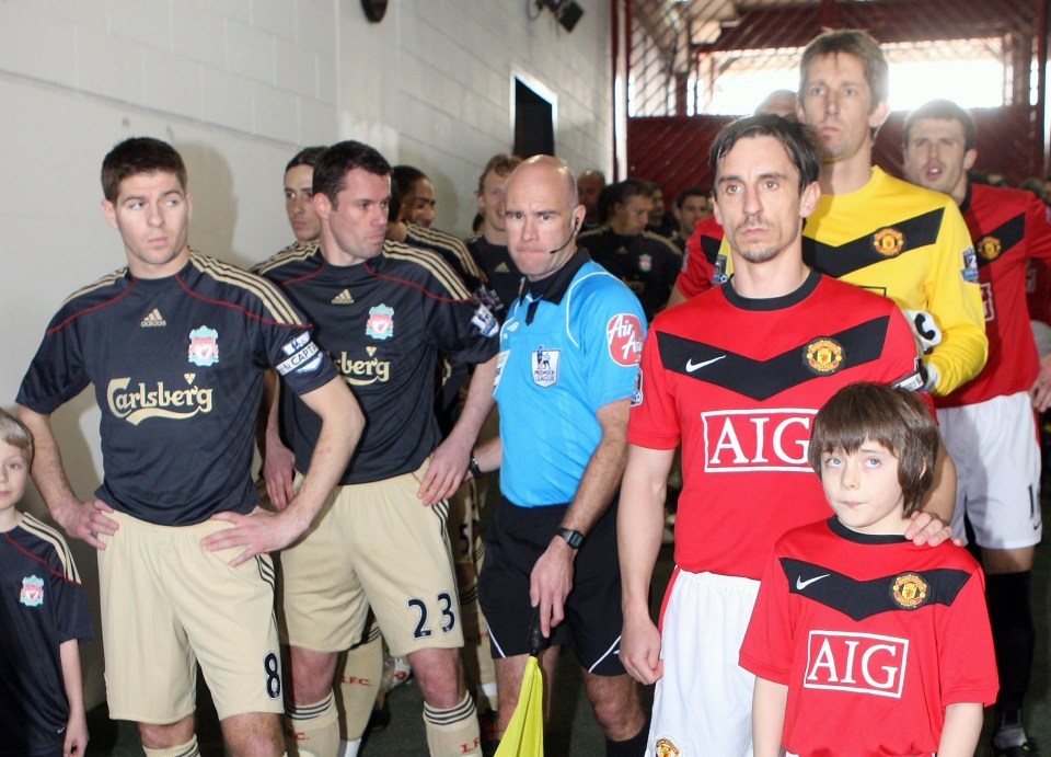 Manchester United and Liverpool players in the tunnel before a match.