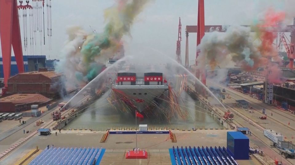 The aircraft carrier was launched with smoke and water jets