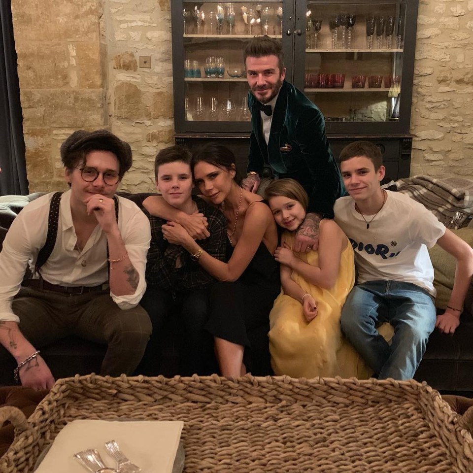 Brooklyn pictured with his famous parents and siblings