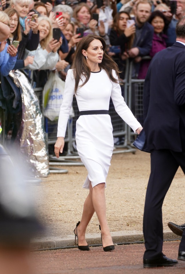 Kate wore a white dress as she chatted with well-wishers