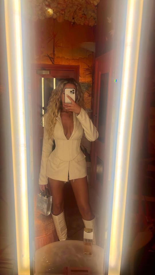 Dani Imbert wowed in a tiny white plunging dress