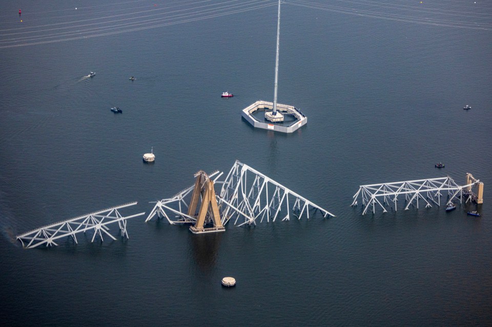 Pieces of the bridge can be seen sticking out of the water