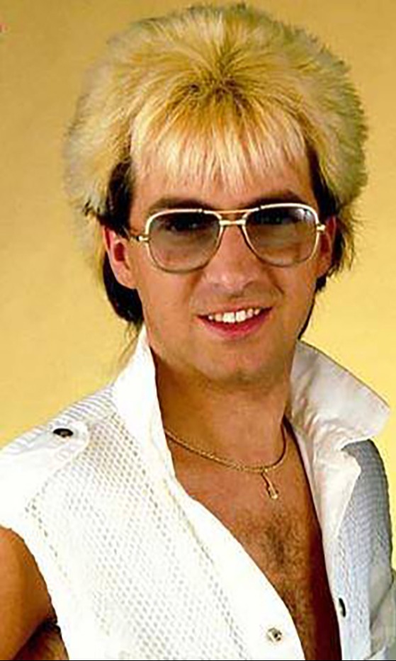 Black Lace star Colin Gibb has died at 70, above with his trademark feather cut in band’s heyday