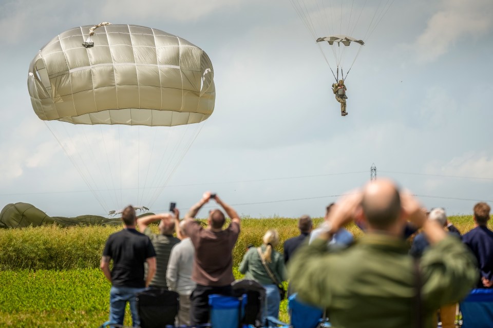 Paratroopers drop in the fields of Sannerville