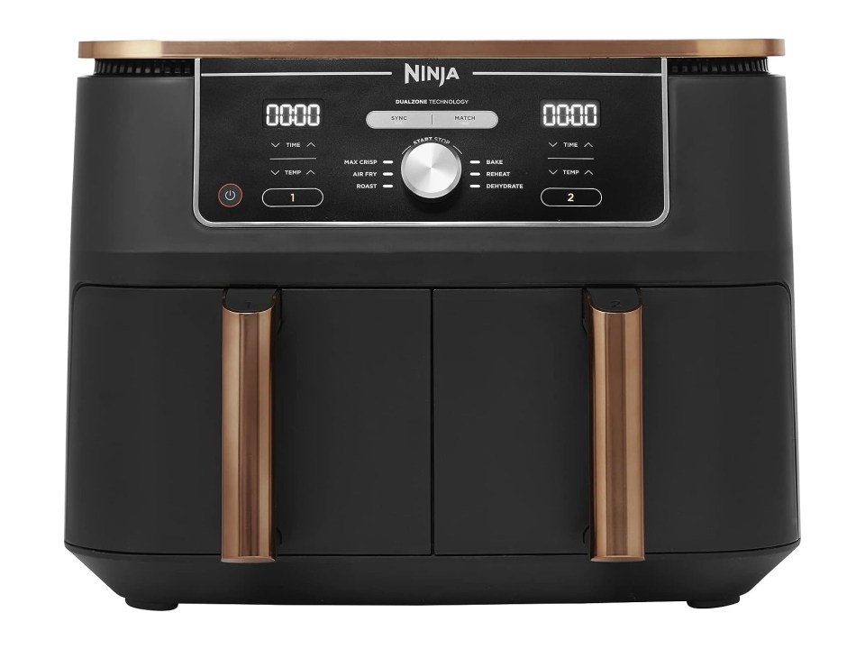a black ninja air fryer with copper handles