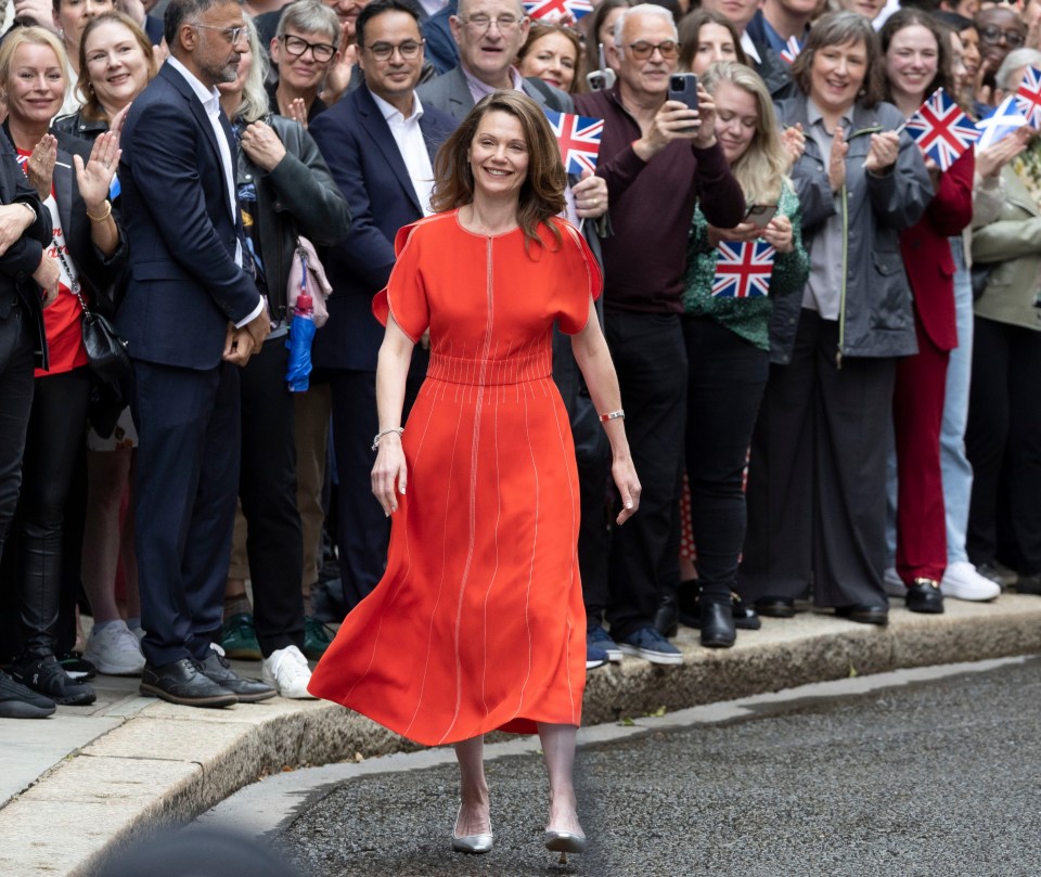 Smiling Victoria walks along Downing Street after Sir Keir becomes PM