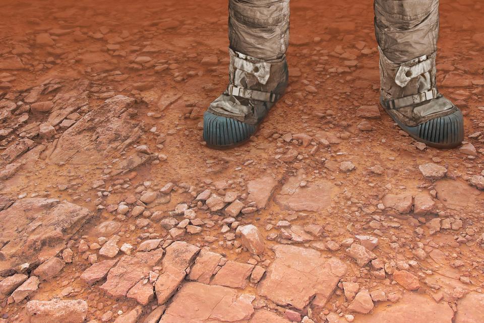 JGN6KA Humans on Mars, artwork. An illustration of a pair of legs on the surface of the red planet, perhaps belonging to future astronauts a or tourists. A human expedition to Mars would be a costly, dangerous but rewarding venture.