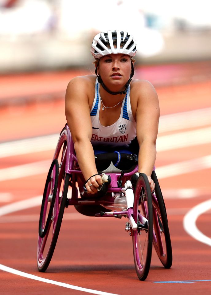 a woman in a wheelchair with the word britain on her shirt