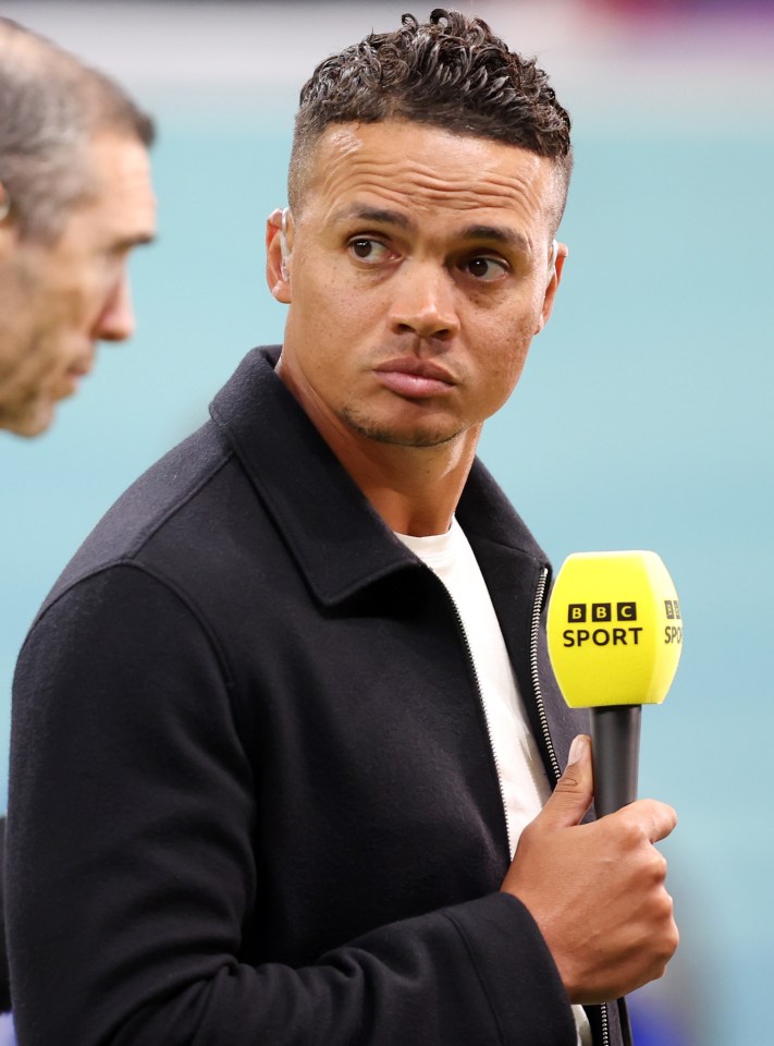 a man holding a microphone that says bbc sport