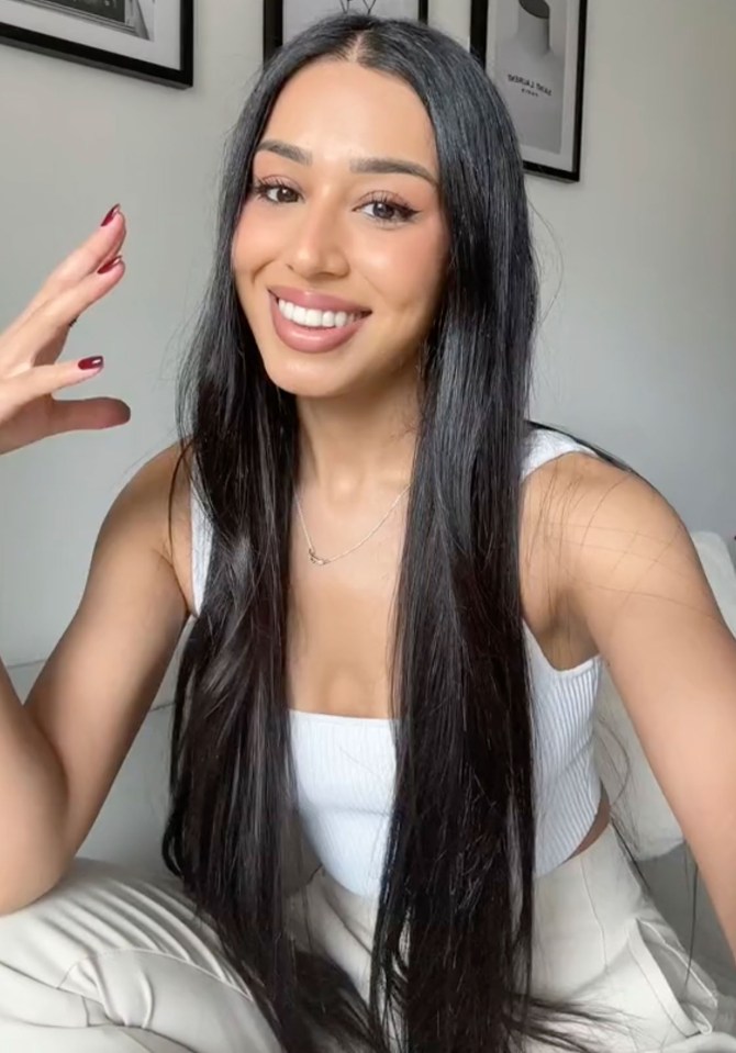 a woman with long black hair is smiling with the caption the origin story of my 7-figure brand