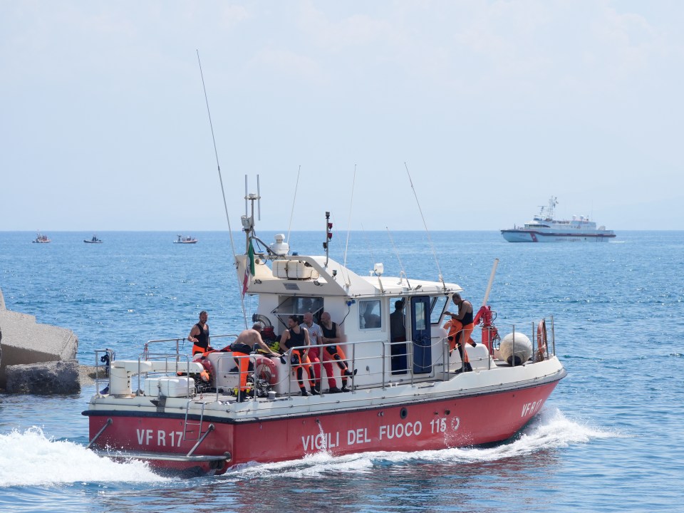 a red boat that says vigili del fuoco on the side