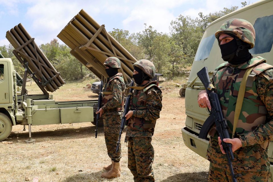 a group of soldiers standing in front of a truck that says ' a ' on it