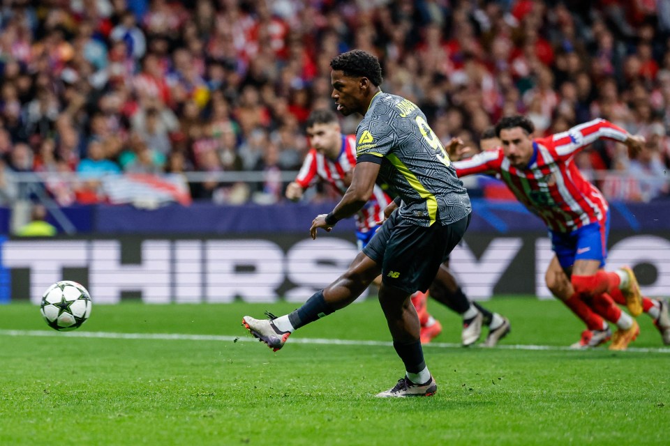 a soccer player with the number 19 on his jersey kicks the ball