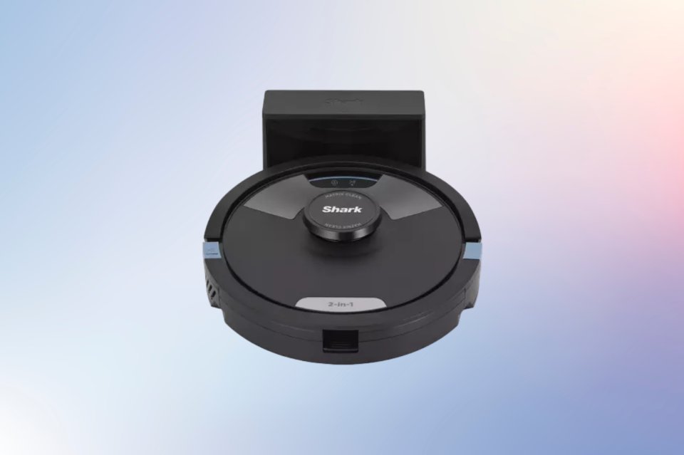 a shark vacuum cleaner is sitting on a charging station