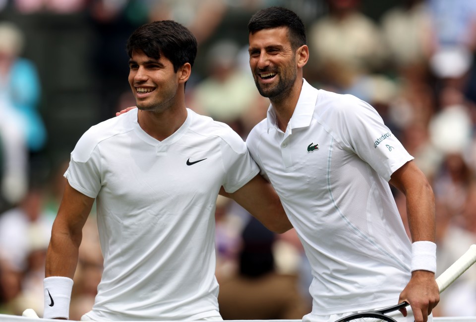 two tennis players are posing for a picture and one has the word lacoste on his shirt