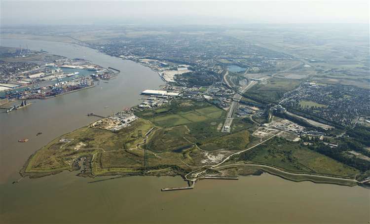 an aerial view of a large body of water with a city in the background