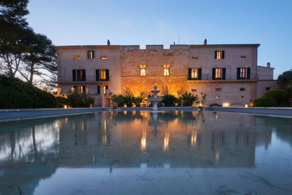 a large building with a fountain in front of it
