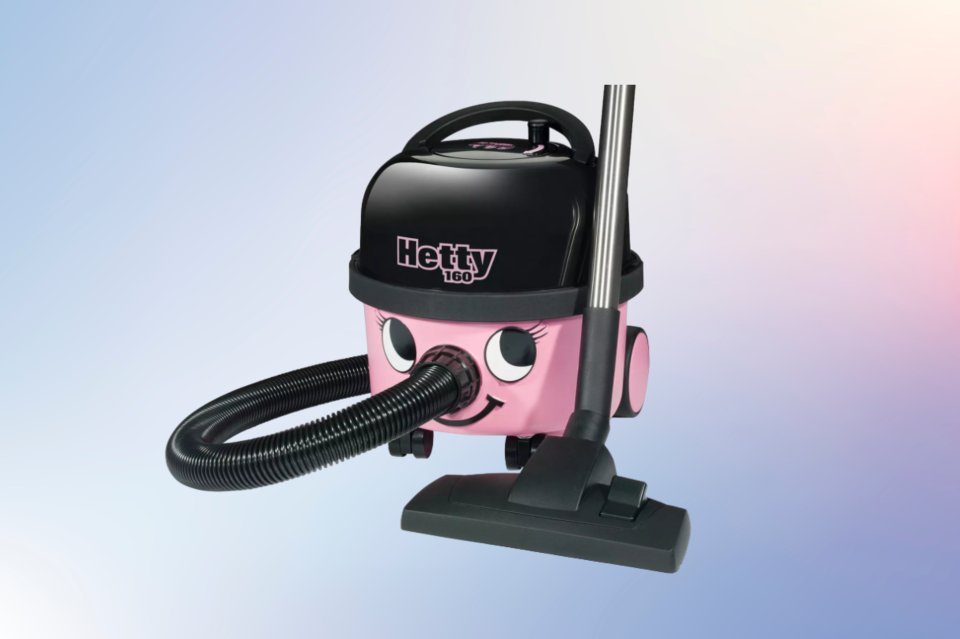 a pink hetty vacuum cleaner with a hose attached to it