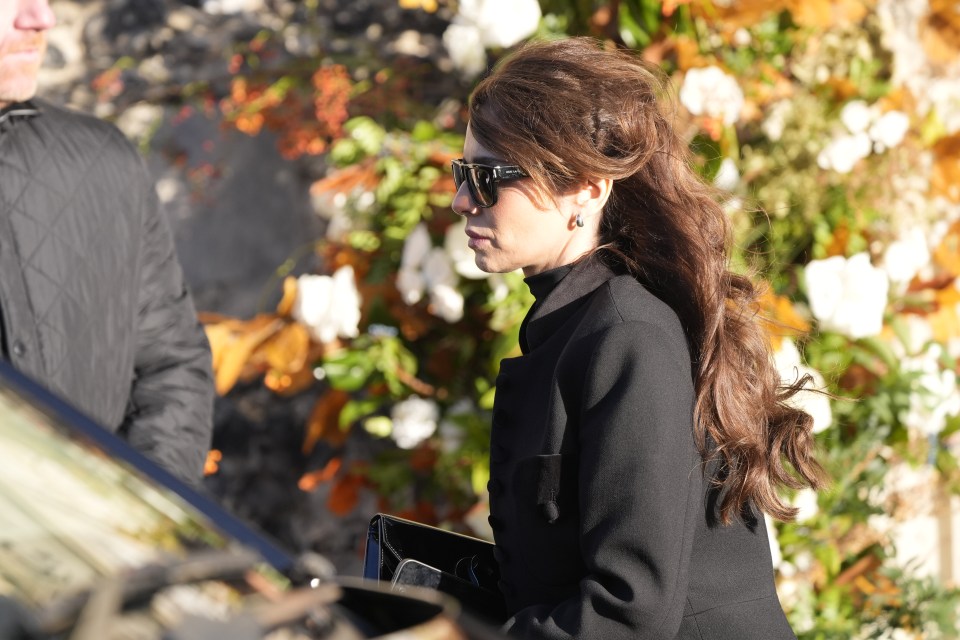 a woman wearing sunglasses with the word prada on them