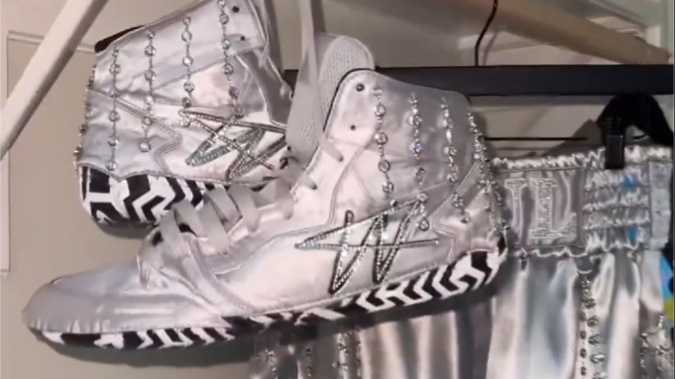 a pair of white shoes with a star on them