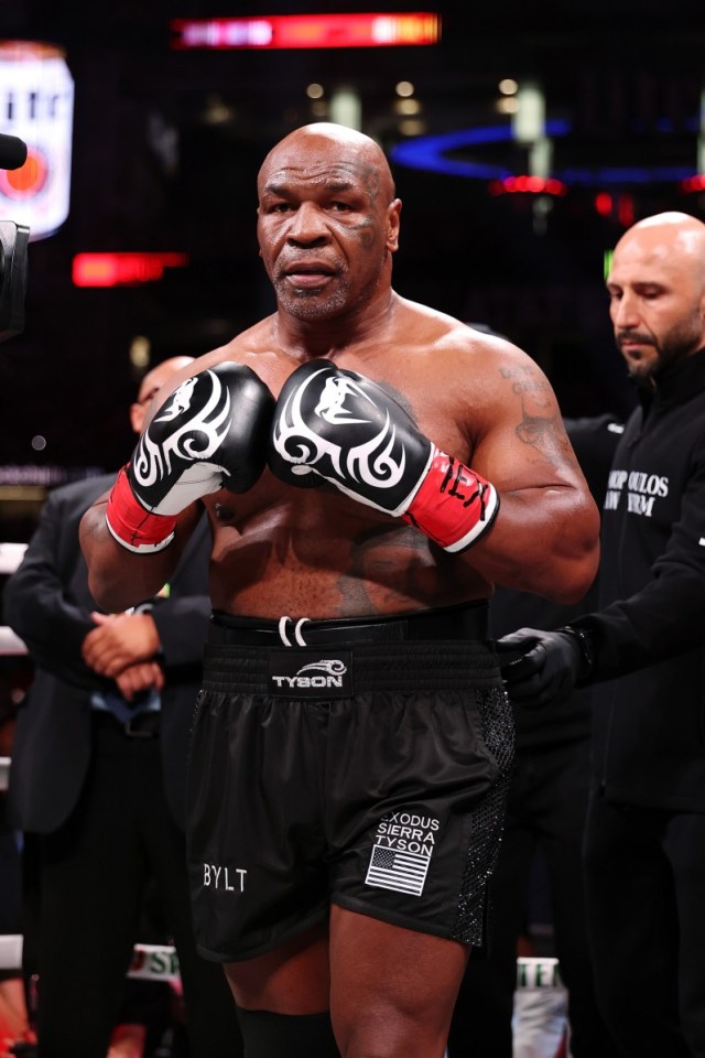 ARLINGTON, TEXAS - NOVEMBER 15: Mike Tyson fights during LIVE On Netflix: Jake Paul vs. Mike Tyson at AT&T Stadium on November 15, 2024 in Arlington, Texas. (Photo by Al Bello/Getty Images for Netflix © 2024)
