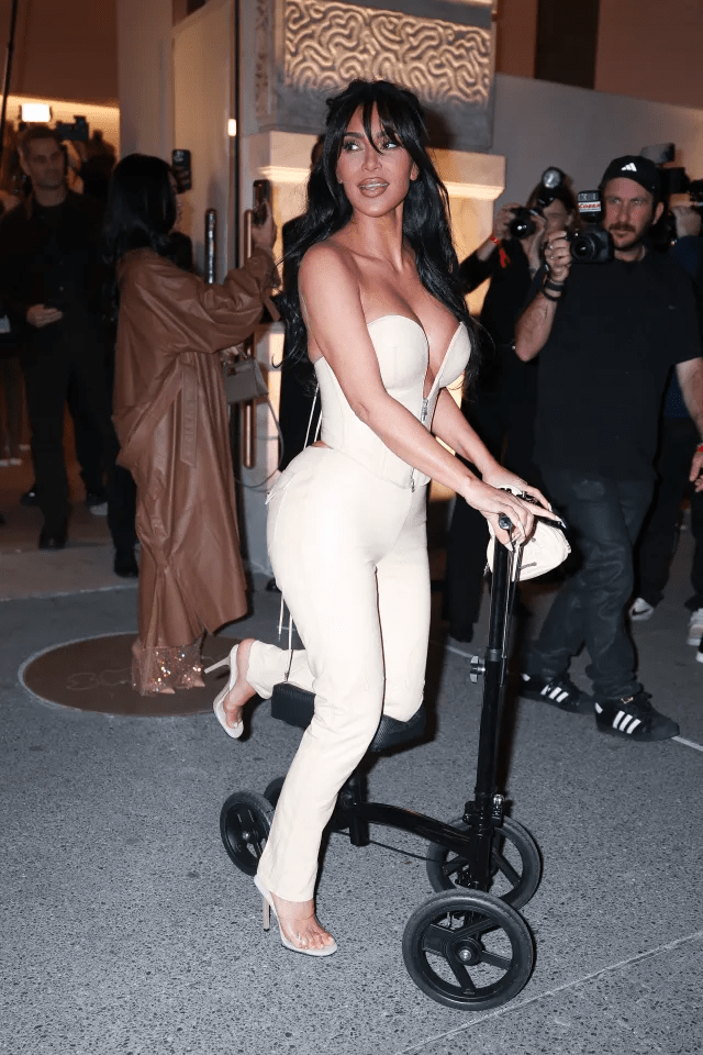 Kim Kardashian on a knee scooter.