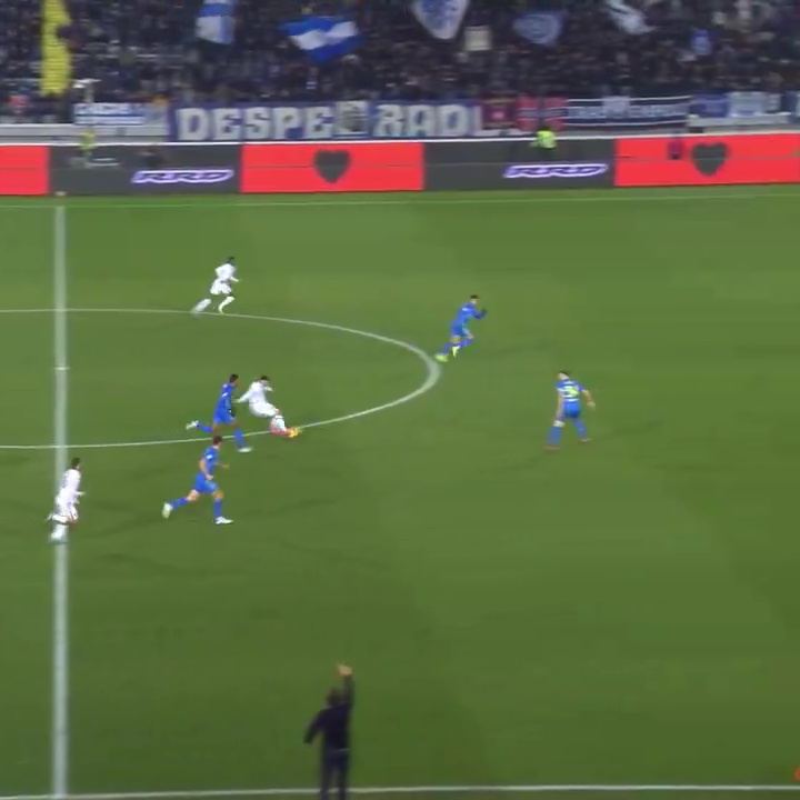 Soccer player scoring a goal.