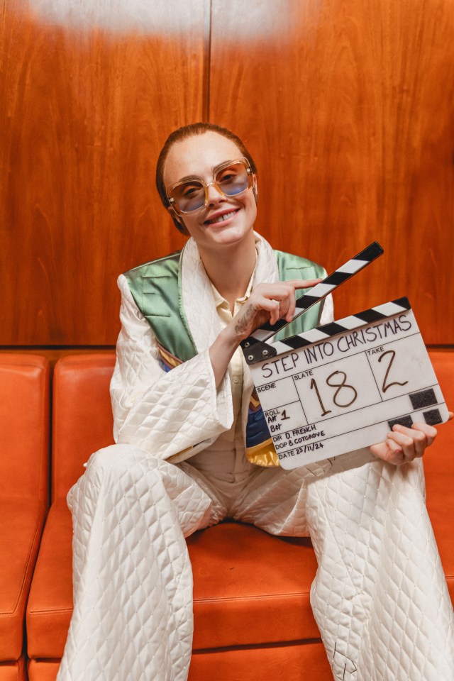 Cara Delevingne on the set of Elton John's "Step Into Christmas" video remake.