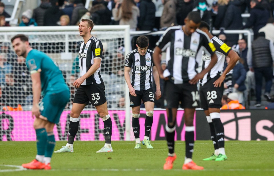 Newcastle United players reacting to conceding a goal.