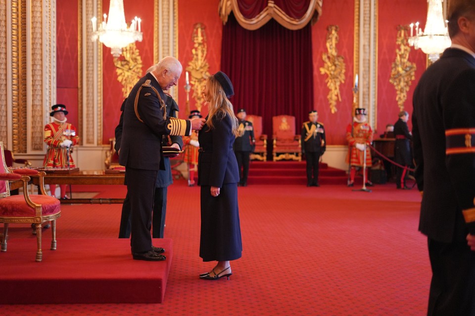 Anya Hindmarch receiving the Dame Commander of the British Empire award from King Charles III at Buckingham Palace.