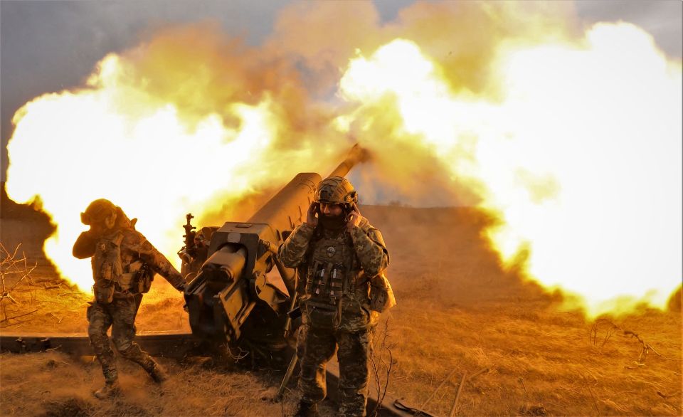 Ukrainian soldiers firing a howitzer near Bakhmut.