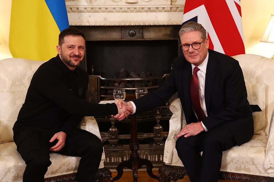 Volodymyr Zelensky and Keir Starmer shaking hands during a bilateral meeting.