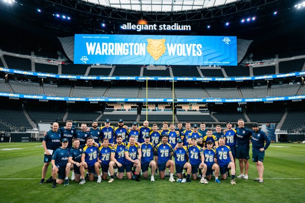 Warrington Wolves rugby team group photo at Allegiant Stadium.