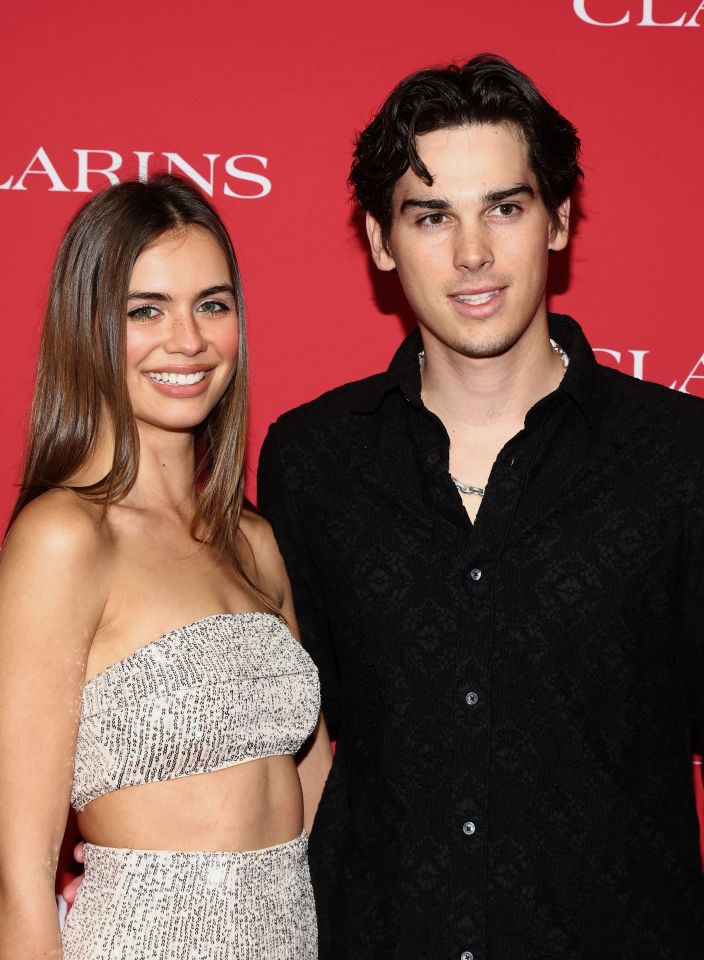 Alex Lee-Aillon and Paris Brosnan at an event.