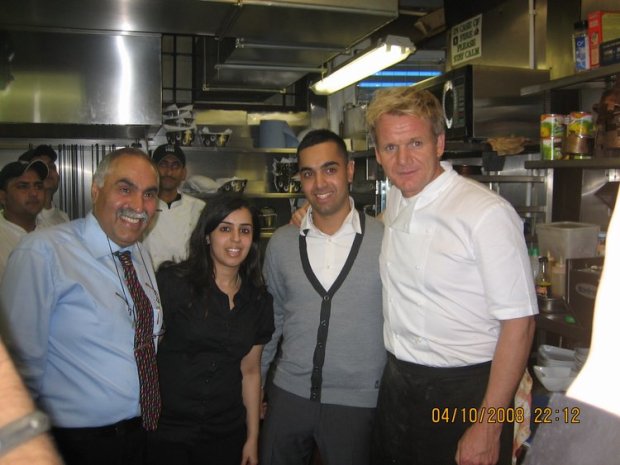 Group photo of Gordon Ramsay with the owners of a Southall restaurant.