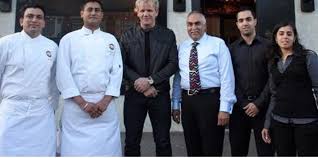 Group photo of Gordon Ramsay with the owners of a Southall restaurant.