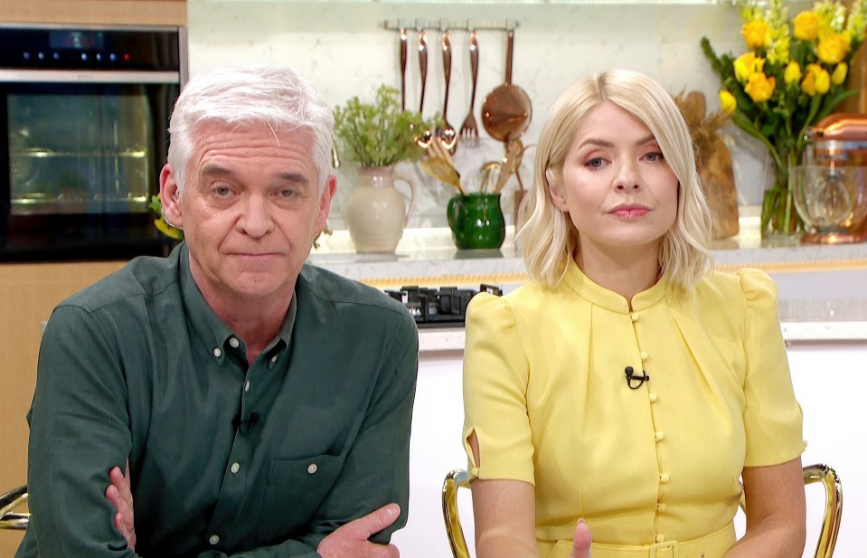 Phil and Holly, This Morning presenters, sitting together.