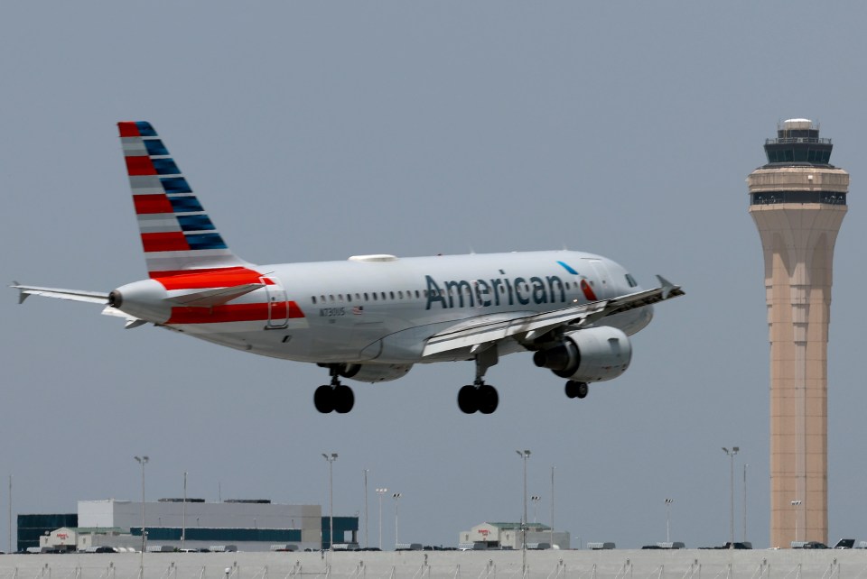 American Airlines plane landing at Miami International Airport.