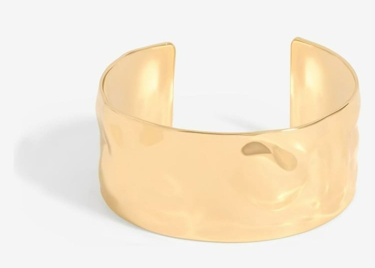 Gold hammered cuff bracelet.