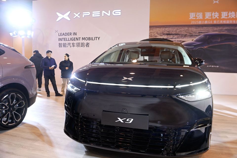 XPENG X9 car at an auto show.